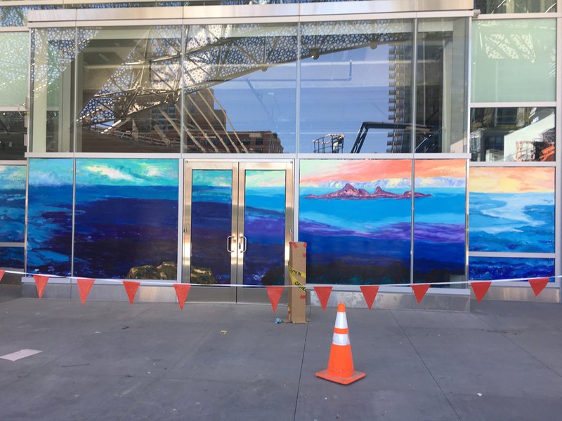 The forty-foot mural in progress on the wall at the Salesforce Transit Center.
